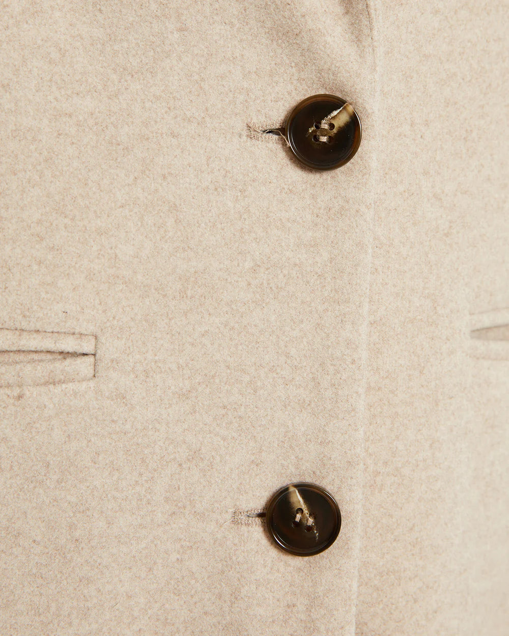 DetalleDetalle de botones y textura del abrigo de mujer de botones y textura del abrigo de mujer