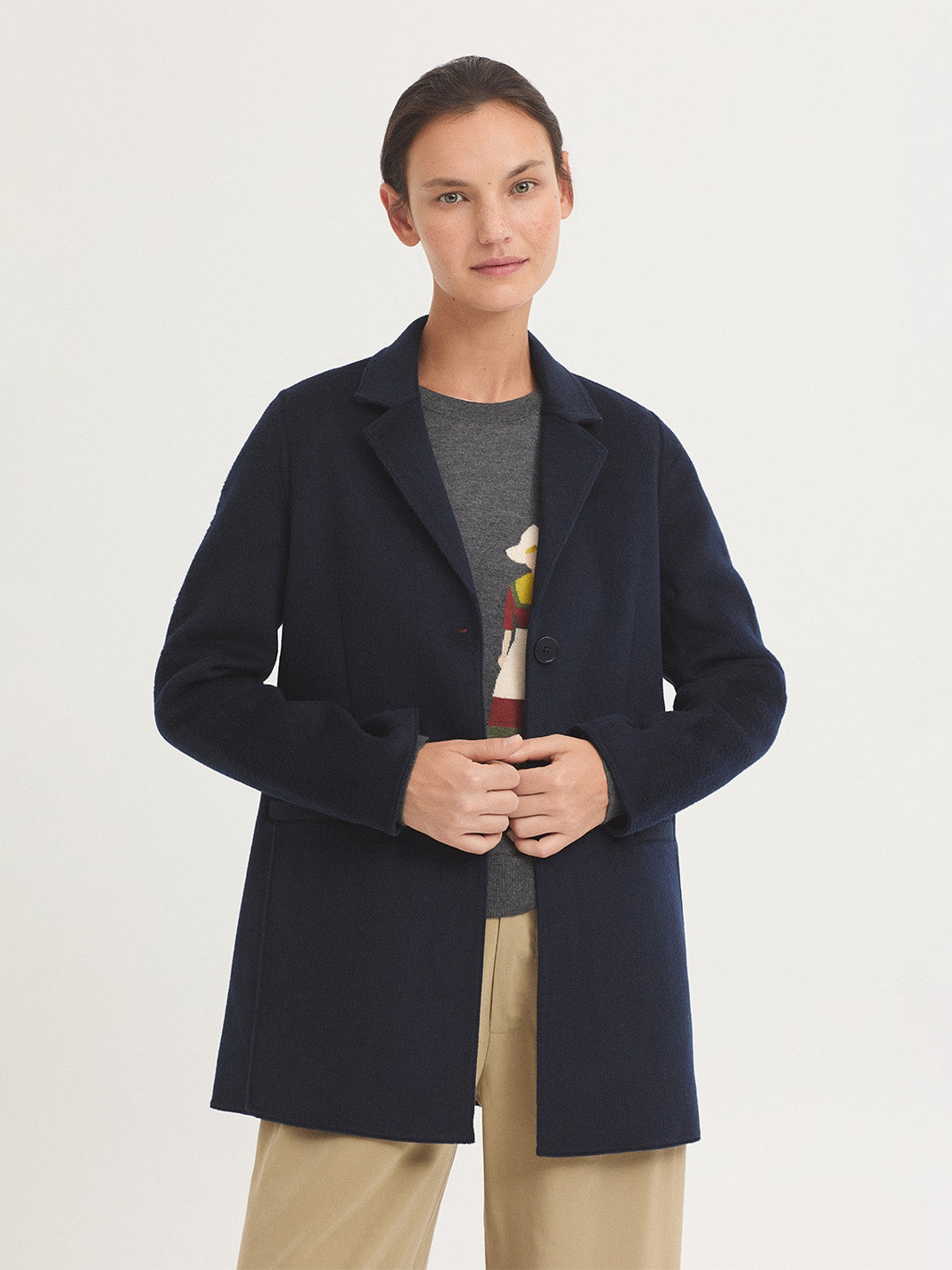 Abrigo con chaleco desmontable Nice Things — detalle del botón